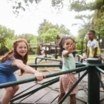 Children playing happily on a merry-go-round